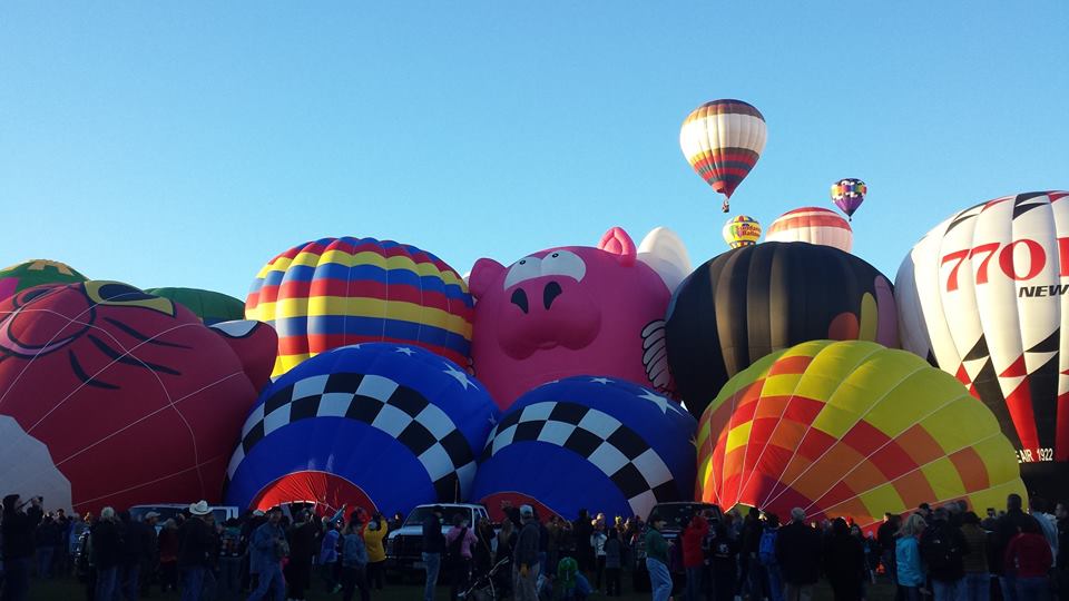 More balloons inflating for takeoff.