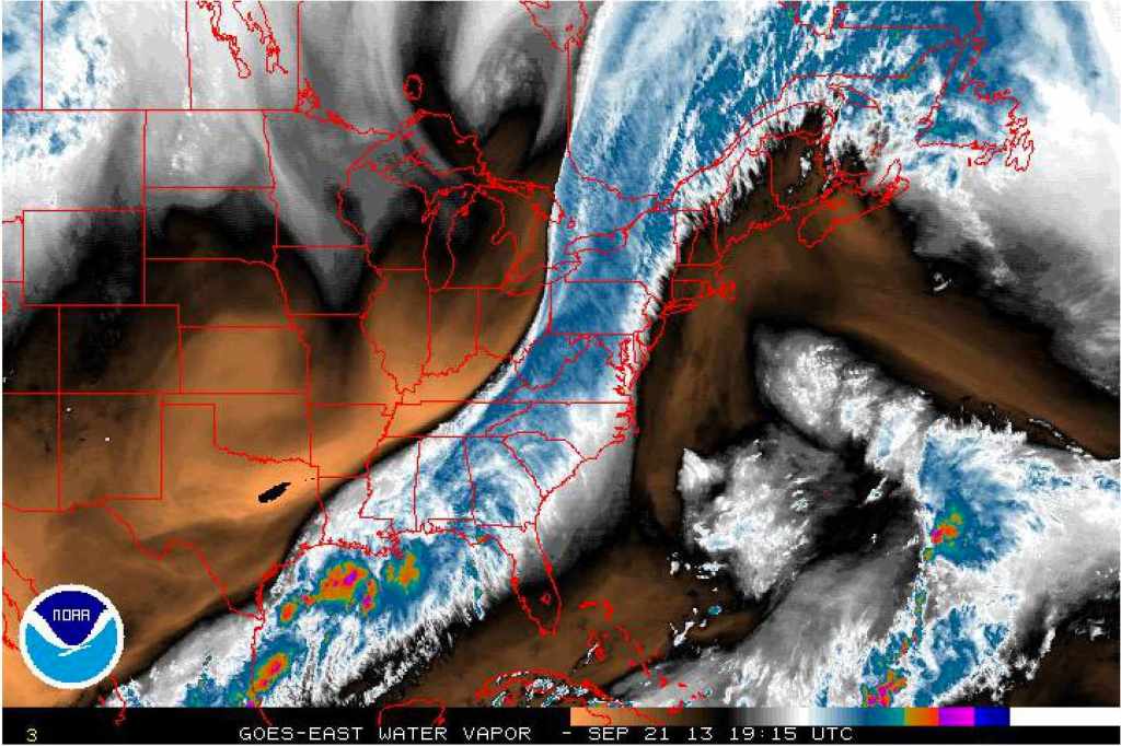 A satellite image for water vapor. Black and orange are drier areas while white and blue are moist.